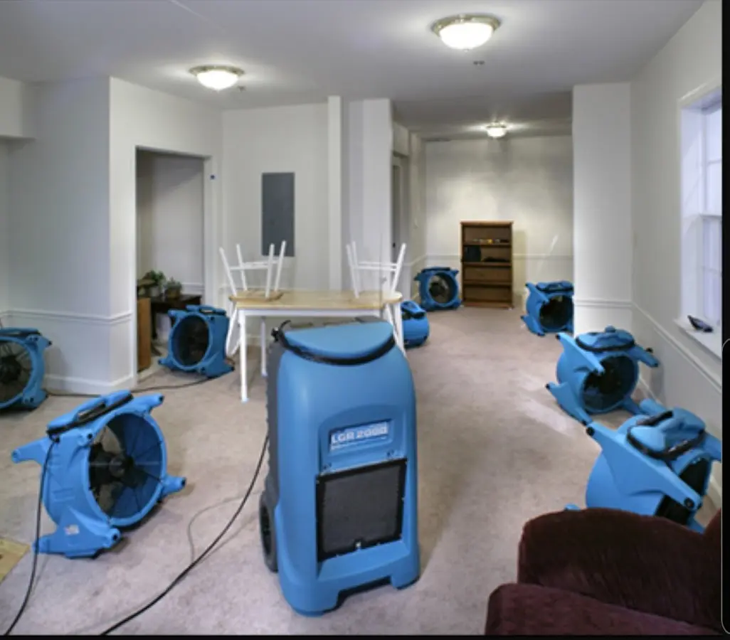 Air movers and dehumidifier setup for Water Damage Restoration in Winchendon